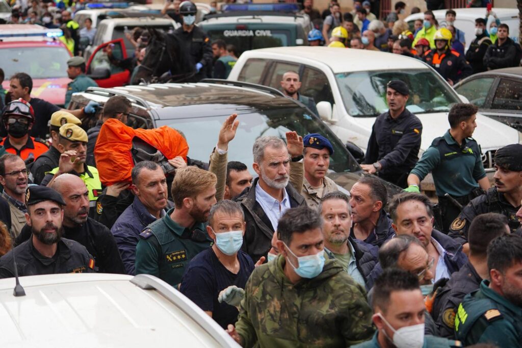 MANAURE QUINTEROAFP
Queen Letizia of Spain (C), with mud stains on her face, listens to a town resident during the Spanish royal couple's visit to Paiporta, in the region of Valencia, eastern Spain, on November 3, 2024, in the aftermath of devastating deadly floods. A delegation led by Spain's king and prime minister was heckled today as it visited the Valencia region hit by deadly floods, with some screaming "assassins" and others throwing mud, according to AFP journalists on the scene. King Felipe VI and Queen Letizia visited the town of Paiporta, one of the most affected by the floods that have killed more than 200 people, alongside Prime Minister Pedro Sanchez and other officials.