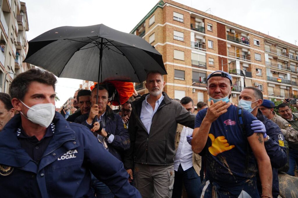 MANAURE QUINTEROAFP
Queen Letizia of Spain (C), with mud stains on her face, listens to a town resident during the Spanish royal couple's visit to Paiporta, in the region of Valencia, eastern Spain, on November 3, 2024, in the aftermath of devastating deadly floods. A delegation led by Spain's king and prime minister was heckled today as it visited the Valencia region hit by deadly floods, with some screaming "assassins" and others throwing mud, according to AFP journalists on the scene. King Felipe VI and Queen Letizia visited the town of Paiporta, one of the most affected by the floods that have killed more than 200 people, alongside Prime Minister Pedro Sanchez and other officials.