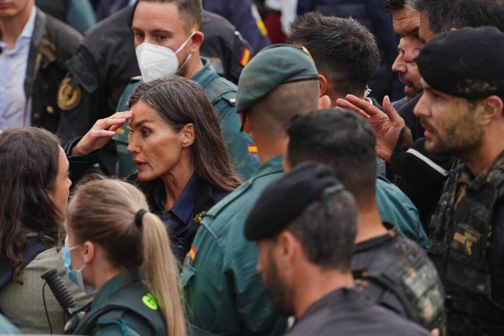 MANAURE QUINTEROAFP
Queen Letizia of Spain (C), with mud stains on her face, listens to a town resident during the Spanish royal couple's visit to Paiporta, in the region of Valencia, eastern Spain, on November 3, 2024, in the aftermath of devastating deadly floods. A delegation led by Spain's king and prime minister was heckled today as it visited the Valencia region hit by deadly floods, with some screaming "assassins" and others throwing mud, according to AFP journalists on the scene. King Felipe VI and Queen Letizia visited the town of Paiporta, one of the most affected by the floods that have killed more than 200 people, alongside Prime Minister Pedro Sanchez and other officials.