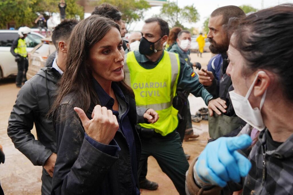 MANAURE QUINTEROAFP
Queen Letizia of Spain (C), with mud stains on her face, listens to a town resident during the Spanish royal couple's visit to Paiporta, in the region of Valencia, eastern Spain, on November 3, 2024, in the aftermath of devastating deadly floods. A delegation led by Spain's king and prime minister was heckled today as it visited the Valencia region hit by deadly floods, with some screaming "assassins" and others throwing mud, according to AFP journalists on the scene. King Felipe VI and Queen Letizia visited the town of Paiporta, one of the most affected by the floods that have killed more than 200 people, alongside Prime Minister Pedro Sanchez and other officials.