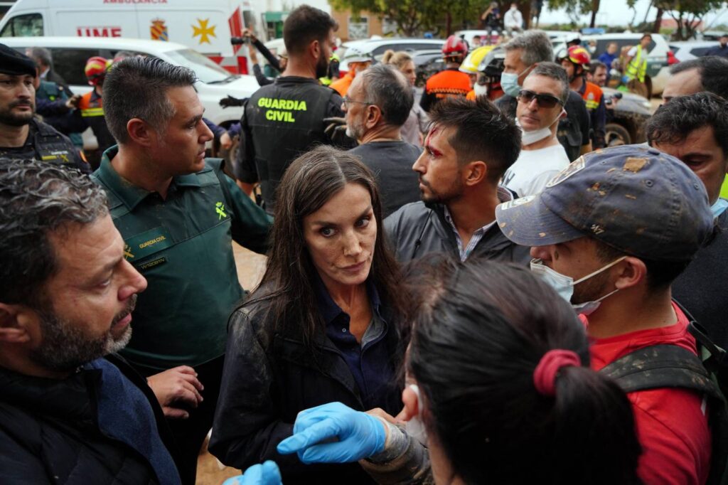 MANAURE QUINTEROAFP
Queen Letizia of Spain (C), with mud stains on her face, listens to a town resident during the Spanish royal couple's visit to Paiporta, in the region of Valencia, eastern Spain, on November 3, 2024, in the aftermath of devastating deadly floods. A delegation led by Spain's king and prime minister was heckled today as it visited the Valencia region hit by deadly floods, with some screaming "assassins" and others throwing mud, according to AFP journalists on the scene. King Felipe VI and Queen Letizia visited the town of Paiporta, one of the most affected by the floods that have killed more than 200 people, alongside Prime Minister Pedro Sanchez and other officials.