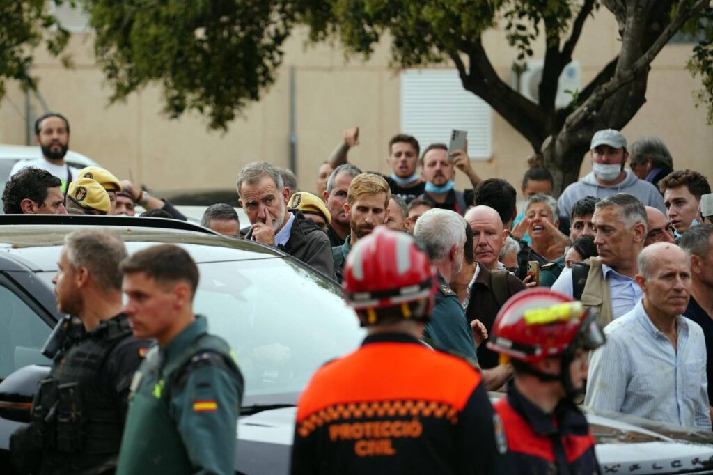 MANAURE QUINTEROAFP
Queen Letizia of Spain (C), with mud stains on her face, listens to a town resident during the Spanish royal couple's visit to Paiporta, in the region of Valencia, eastern Spain, on November 3, 2024, in the aftermath of devastating deadly floods. A delegation led by Spain's king and prime minister was heckled today as it visited the Valencia region hit by deadly floods, with some screaming "assassins" and others throwing mud, according to AFP journalists on the scene. King Felipe VI and Queen Letizia visited the town of Paiporta, one of the most affected by the floods that have killed more than 200 people, alongside Prime Minister Pedro Sanchez and other officials.